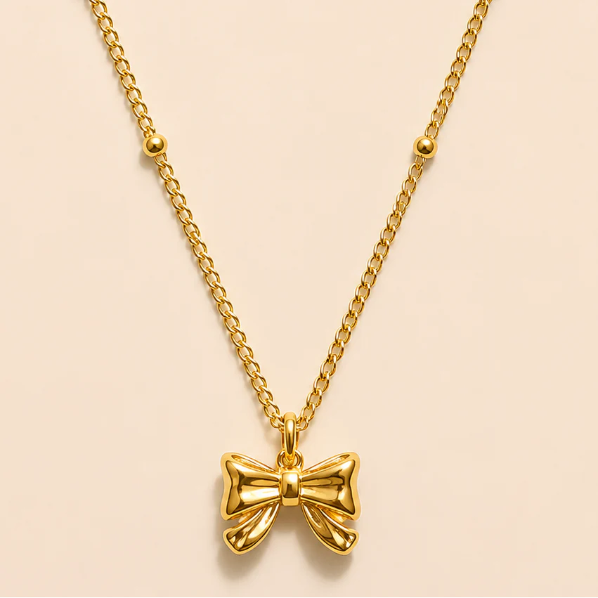 Gold satellite Bow tie necklace