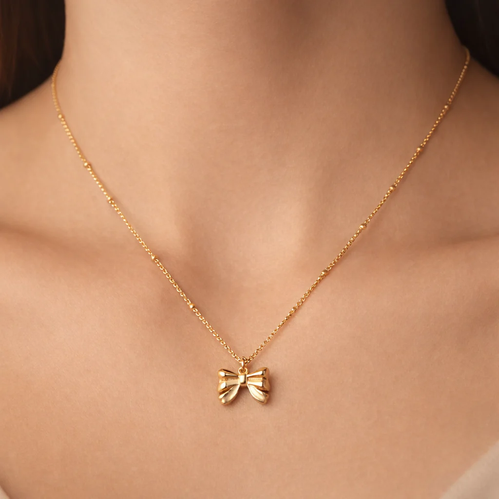 Gold satellite Bow tie necklace - Image 2